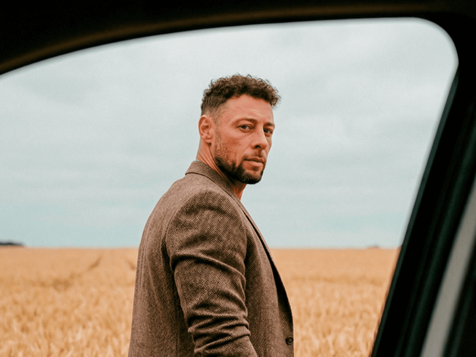 Troy Laing in a wheat field